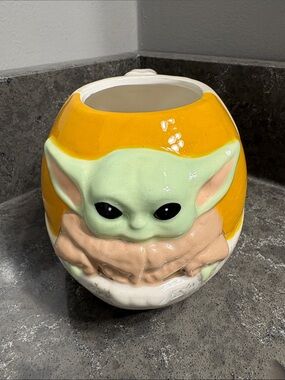 Star Wars Mandalorian sculptured mug features Grogu sitting in his hover pram.